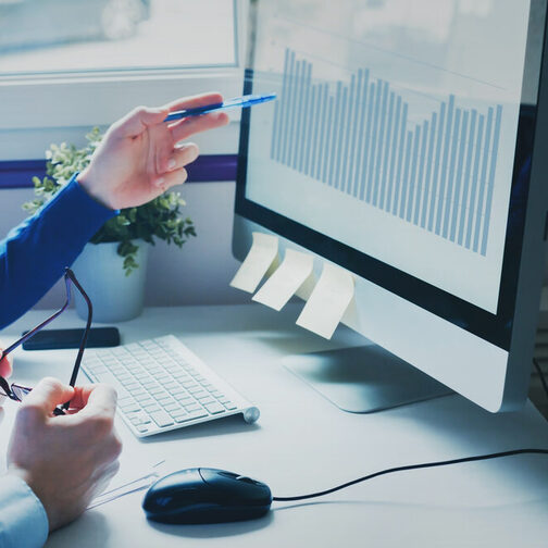 group of business people coworkers looking at computer, team working